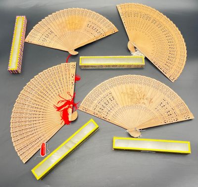 six chinese fans and a box of matches on a table