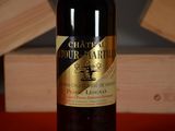 a bottle of wine that is sitting on a table
