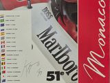 the poster for the monaco grand prix is displayed on the wall