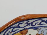 a close up of a bowl with flowers on it