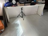 an image of a room with a tv and a tripod
