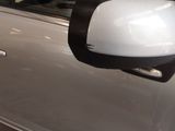 a side view mirror on the side of a car