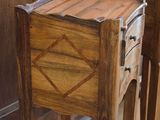 two wooden tables with drawers on them in a room