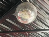 a disco ball hanging from the ceiling of a restaurant