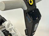 a close up of a bike handle with a cell phone attached to it