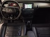 the interior of a car with a steering wheel, dashboard, and dash board