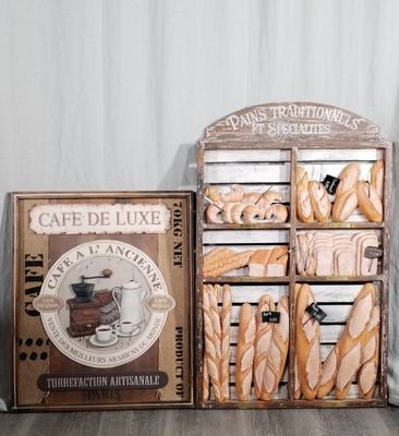 many breads and pastries on display on a table