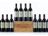 a group of bottles of wine sitting next to a wooden box