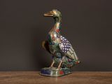 a bird that is sitting on top of a wooden table