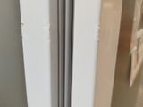 a close up of a refrigerator door with a handle on it