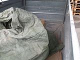a large bag of wood in the back of a truck