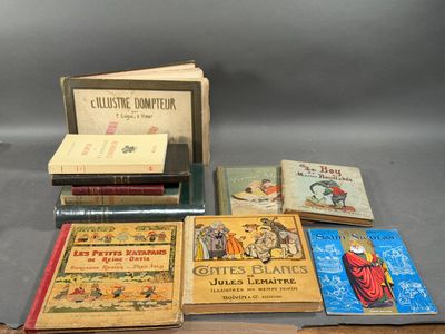 several books are sitting on a table next to each other