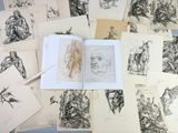 a lot of drawings that are on the table
