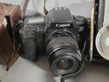 a camera that is sitting next to some old cameras