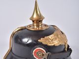 an old helmet with a winged decoration on the top of it