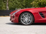 the red sports car is parked on the side of the road