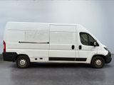 a white van that is parked in a parking lot