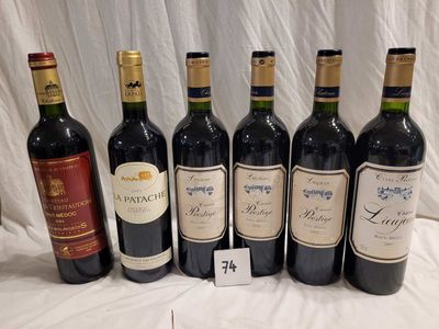 several bottles of wine are lined up on a table