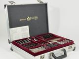silverware in a silver case on a white surface