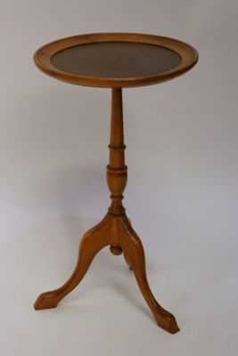 a wooden table with a glass top on a white background