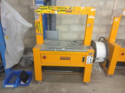 two machines that are sitting next to each other