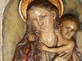 an image of a statue of a woman holding a child