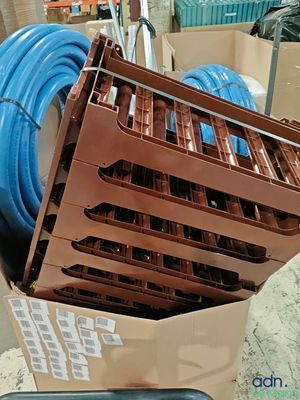 a box with a bunch of blue hoses inside of it