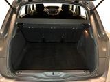 the back of a car with the trunk open and the seats folded down