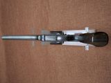 a gun that is sitting on a piece of paper