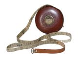 a measuring tape wrapped around a leather case