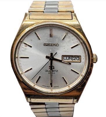 SEIKO Montre bracelet homme, en acier et métal doré, à guich…