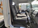 a view of the inside of a truck from the driver ' s seat