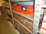 boxes are stacked on a shelf in a storage room in a warehouse