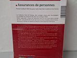 the back cover of a book on a table with a white wall in the background