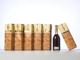a bottle of wine and a box of cigarettes on a table
