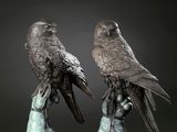 paire de sculptures en bronze représentant deux oiseaux perchés l'un sur l'autre