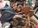 a lot of stuff on a table outside on the street