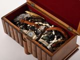 a wooden box with many different types of watches in it