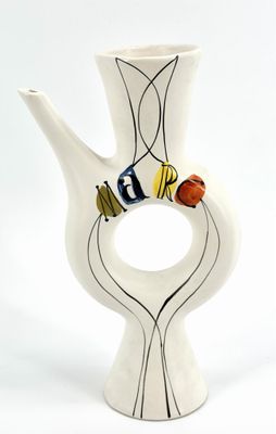 a white vase with a black and white design on it