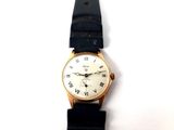 a gold wrist watch with roman numerals on it