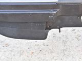 a close up of a gun that is on the ground