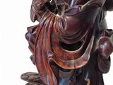 a statue of a man holding a bird on his arm