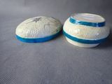 two bowls that are sitting next to each other on a table