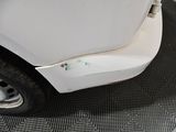 a close up of a car door with a hole in it