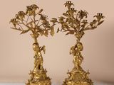 pair of antique brass candelabs with flowers and birds