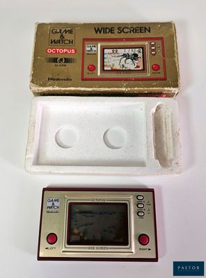a small electronic device sitting on a table next to a box