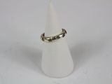 a close up of a ring on a cone on a white surface