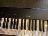 a close up of a piano keyboard with many keys