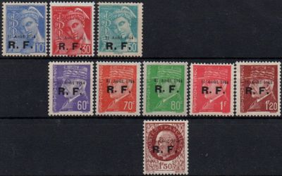 a close up of a group of stamps on a black surface