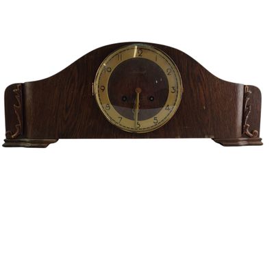 an image of a wooden clock sitting on top of a white surface